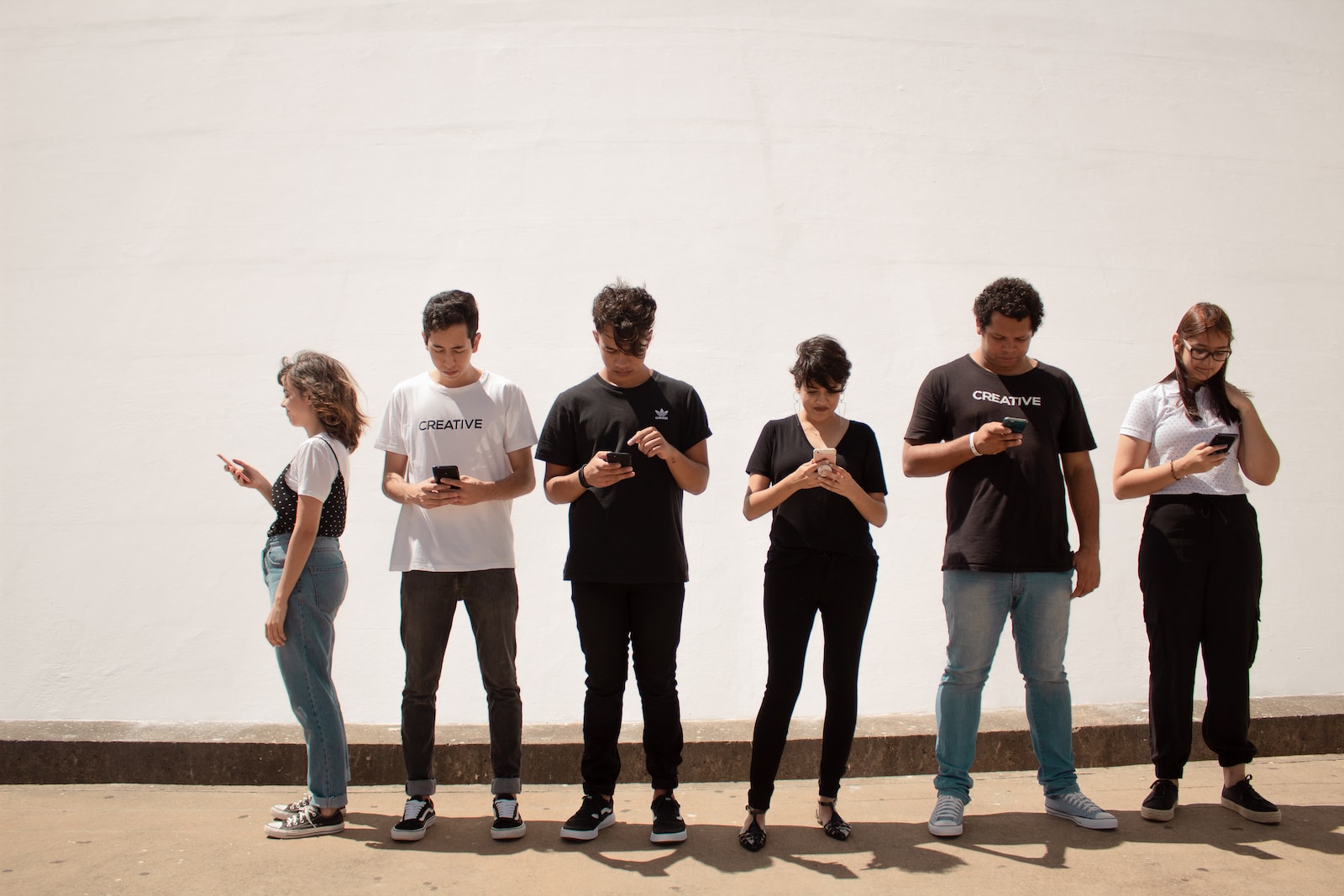 smartphone group of people standing on brown floor