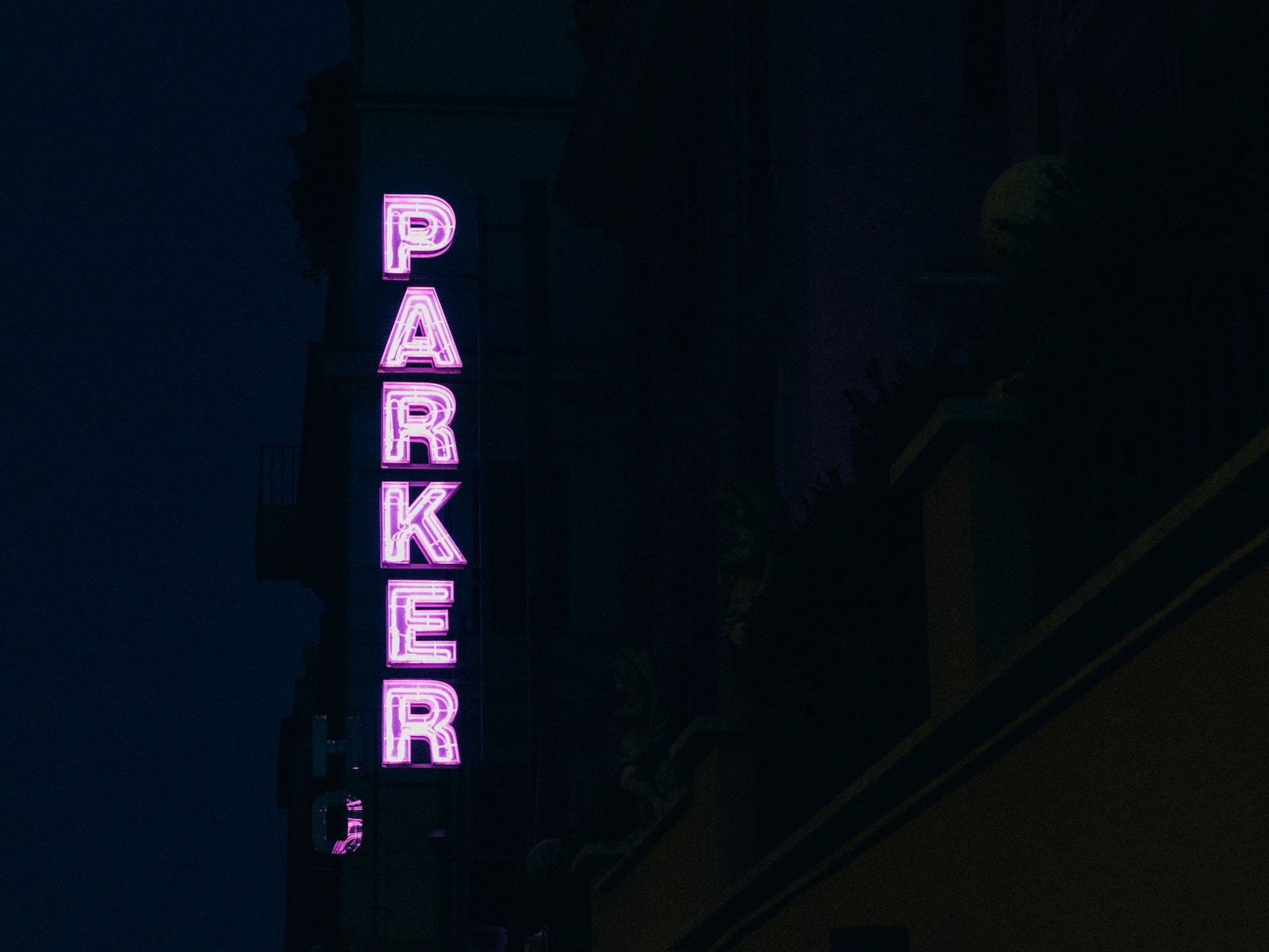 Katrina Parker lit Parker neon light signage on a side of a building